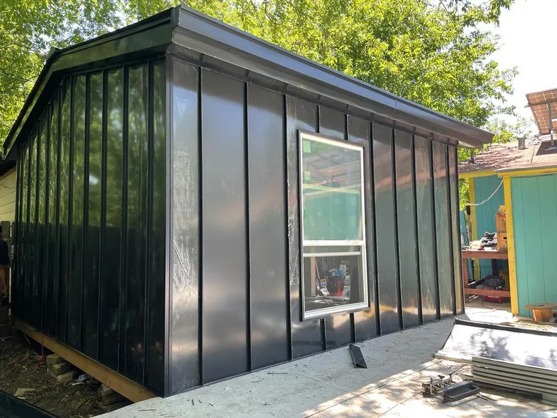 Black standing seam metal wall panels for Roof Inspection in San Marcos